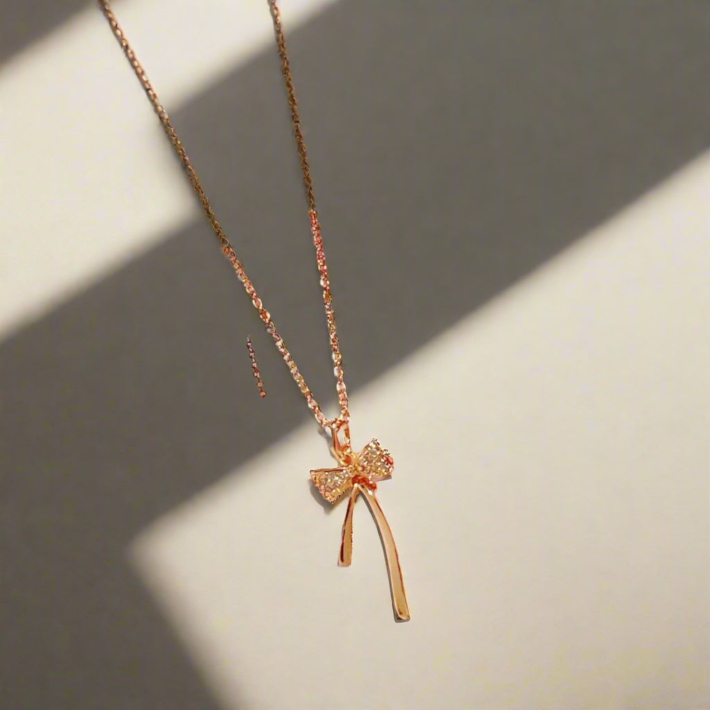 Elegant Ribbon Pendant Necklace β Minimalist Gold Charm Jewelry