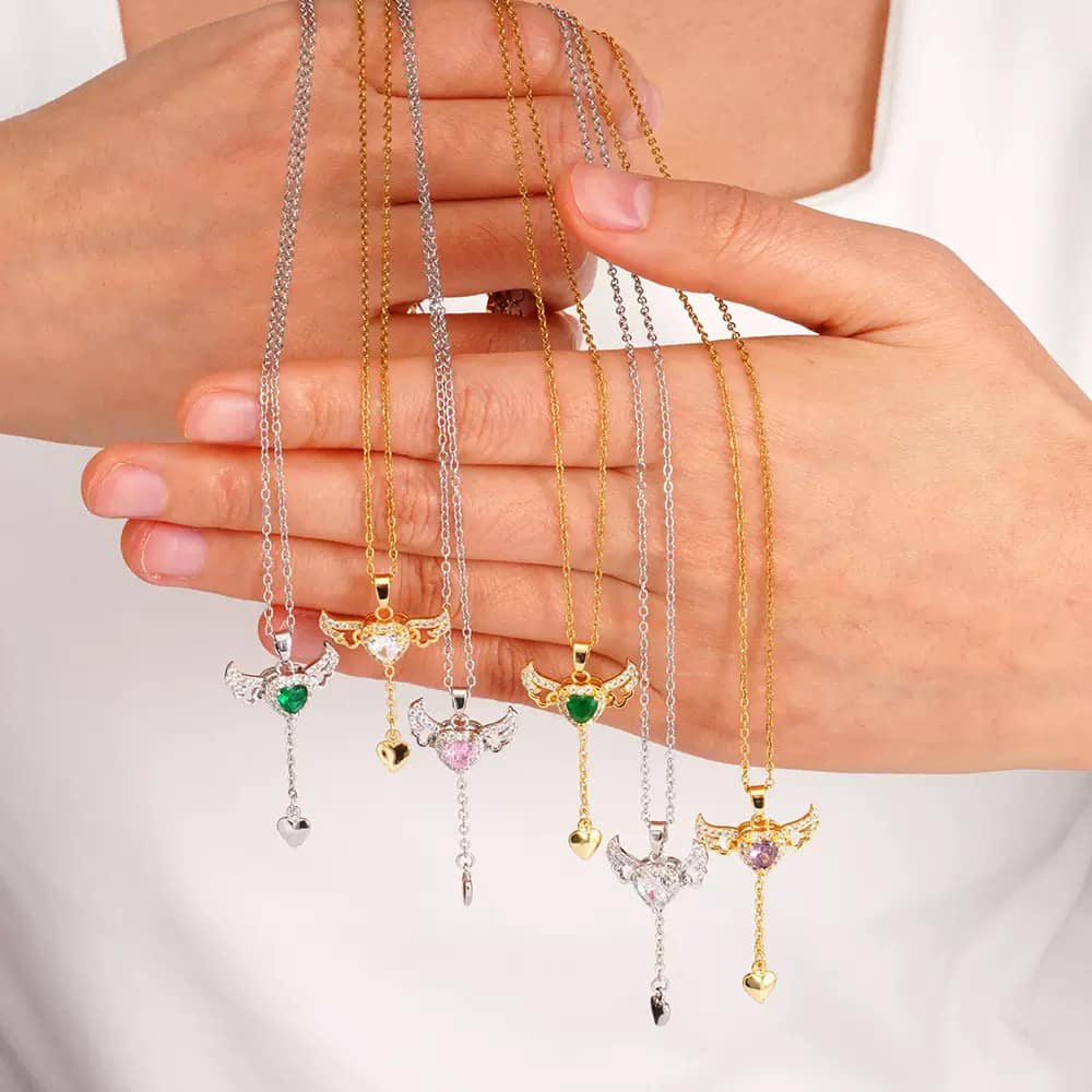 Gold Bird Pendant Necklace – Sparkling Stone with Heart Drop Charm